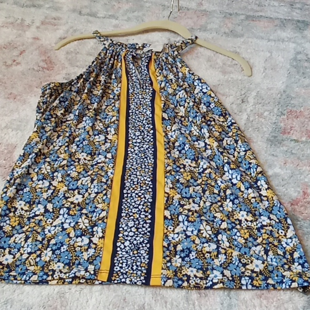 Michael Kors sleeveless blouse, with V-neck in front and back, size small.